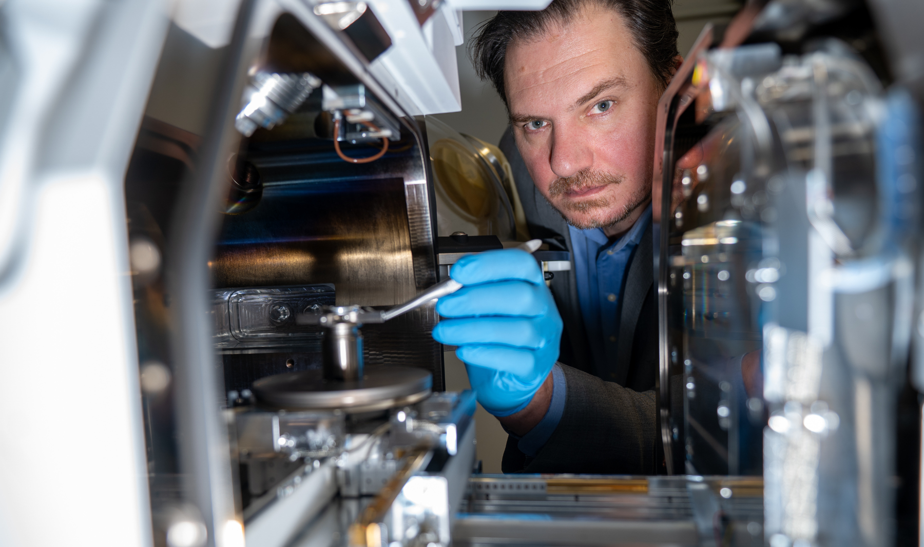 Nabil Bassim looking into focused ion beam.
